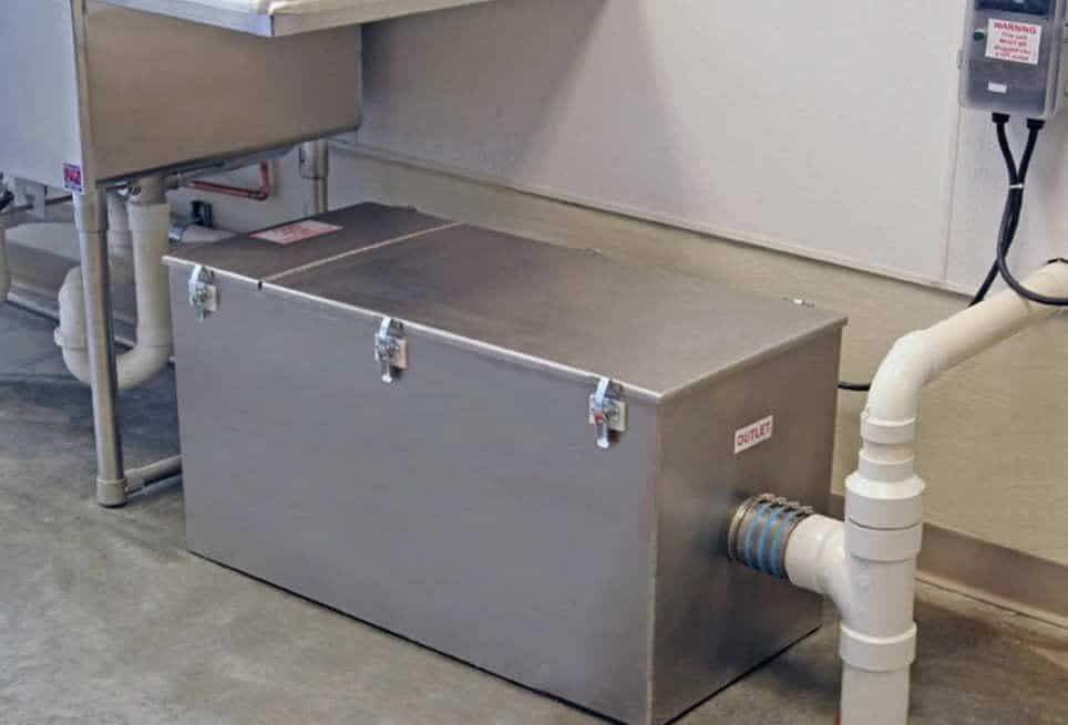 Grease trap monitoring system preventing costly overflows in restaurant kitchen